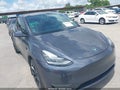 2023 Tesla Model Y — photo 6 of 18 | VIN 7SAYGDEE9PA121261