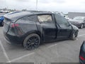 2025 Tesla Model Y — photo 12 of 21 | VIN 7SAYGDED6SF228366