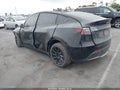 2025 Tesla Model Y — photo 3 of 21 | VIN 7SAYGDED6SF228366