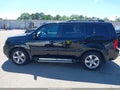 2012 Honda Pilot — photo 14 of 16 | VIN 5FNYF4H57CB050022