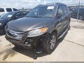 2012 Hyundai Santa Fe — photo 2 of 17 | VIN 5XYZH4AG5CG156679