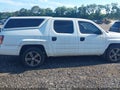2014 Honda Ridgeline — photo 13 of 17 | VIN 5FPYK1F74EB010229