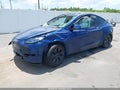 2024 Tesla Model Y — photo 2 of 17 | VIN 7SAYGDED3RA331137