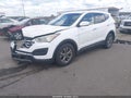 2014 Hyundai Santa Fe — photo 2 of 16 | VIN 5XYZT3LB2EG131963