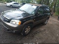 2004 Mazda Tribute — photo 2 of 11 | VIN 4F2CZ94124KM25479