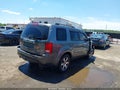 2012 Honda Pilot — photo 4 of 11 | VIN 5FNYF4H93CB043877