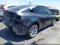 2024 Tesla Model Y — photo 4 of 20 | VIN 7SAYGAEE1RF091533