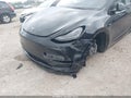 2023 Tesla Model Y — photo 6 of 18 | VIN 7SAYGDEE5PF909358