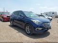 2017 Hyundai Santa Fe — photo 1 of 16 | VIN 5XYZU3LB6HG461056