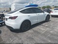 2025 Tesla Model Y — photo 4 of 18 | VIN 7SAYGDED7SA374238