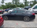 2015 Acura TLX — photo 14 of 16 | VIN 19UUB3F50FA004697