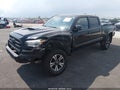 2016 Toyota Tacoma — photo 2 of 16 | VIN 3TMDZ5BN7GM010111