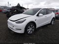 2023 Tesla Model Y — photo 2 of 21 | VIN 7SAYGDEE4PF808327