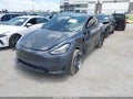 2024 Tesla Model Y — photo 2 of 16 | VIN 7SAYGDEE6RA217626