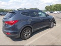 2014 Hyundai Santa Fe — photo 4 of 16 | VIN 5XYZU3LB1EG223840