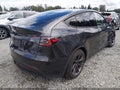 2025 Tesla Model Y — photo 4 of 21 | VIN 7SAYGDED0SF313297