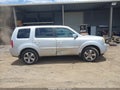 2014 Honda Pilot — photo 13 of 16 | VIN 5FNYF3H52EB014090