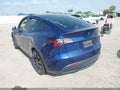 2023 Tesla Model Y — photo 3 of 17 | VIN 7SAYGDEF3PF774969