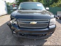 2011 Chevrolet Suburban — photo 12 of 16 | VIN 1GNSKKE33BR239968
