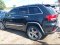 2011 Jeep Grand Cherokee — photo 14 of 16 | VIN 1J4RR6GT1BC509851