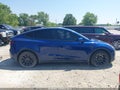 2024 Tesla Model Y — photo 12 of 17 | VIN 7SAYGDEE7RA238971
