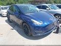 2023 Tesla Model Y — photo 1 of 23 | VIN 7SAYGAEE4PF851225