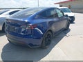 2023 Tesla Model Y — photo 4 of 23 | VIN 7SAYGAEE4PF851225