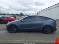 2023 Tesla Model Y — photo 14 of 18 | VIN 7SAYGDEF6PF668595