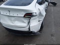 2021 Tesla Model Y — photo 6 of 14 | VIN 5YJYGAEE0MF145426