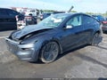 2026 Tesla Model Y — photo 2 of 15 | VIN 7SAYGDEE5TA410485