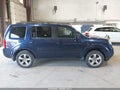 2013 Honda Pilot — photo 13 of 16 | VIN 5FNYF4H52DB077288