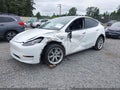 2022 Tesla Model Y — photo 2 of 21 | VIN 7SAYGAEEXNF520212
