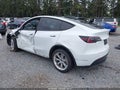 2022 Tesla Model Y — photo 3 of 21 | VIN 7SAYGAEEXNF520212