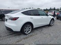 2022 Tesla Model Y — photo 4 of 21 | VIN 7SAYGAEEXNF520212