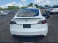 2022 Tesla Model Y — photo 15 of 17 | VIN 7SAYGDEFXNF445585