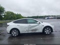 2022 Tesla Model Y — photo 12 of 15 | VIN 7SAYGAEE0NF429515