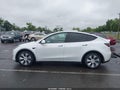 2022 Tesla Model Y — photo 13 of 15 | VIN 7SAYGAEE0NF429515
