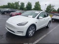 2022 Tesla Model Y — photo 2 of 15 | VIN 7SAYGAEE0NF429515