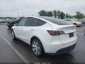 2022 Tesla Model Y — photo 3 of 15 | VIN 7SAYGAEE0NF429515