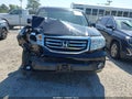 2014 Honda Pilot — photo 11 of 15 | VIN 5FNYF4H52EB030392