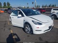 2023 Tesla Model Y — photo 1 of 16 | VIN 7SAYGDEE1PA066952