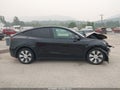 2021 Tesla Model Y — photo 12 of 15 | VIN 5YJYGDEE4MF196381