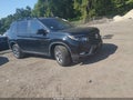 2023 Honda Passport — photo 1 of 16 | VIN 5FNYF8H68PB027015