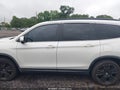 2021 Honda Pilot — photo 14 of 16 | VIN 5FNYF5H23MB039905