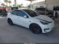 2022 Tesla Model Y — photo 1 of 14 | VIN 7SAYGDEF9NF380762