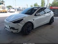 2022 Tesla Model Y — photo 2 of 14 | VIN 7SAYGDEF9NF380762