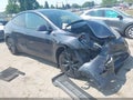 2024 Tesla Model Y — photo 1 of 14 | VIN 7SAYGDEE4RF128284