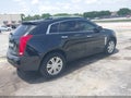 2014 Cadillac SRX — photo 4 of 19 | VIN 3GYFNBE3XES649745
