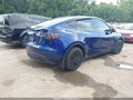 2023 Tesla Model Y — photo 4 of 20 | VIN 7SAYGDEE7PA088003