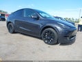 2024 Tesla Model Y — photo 1 of 14 | VIN 7SAYGDEE2RA317125